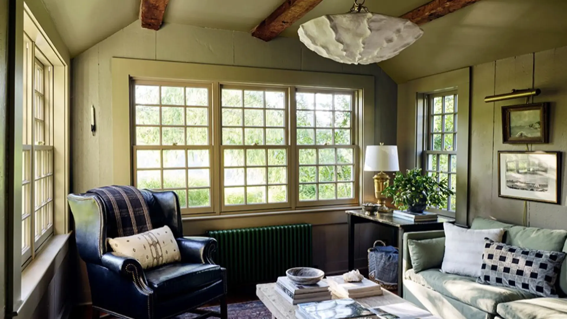 Wide shot of a historic Main Line living room with original windows.