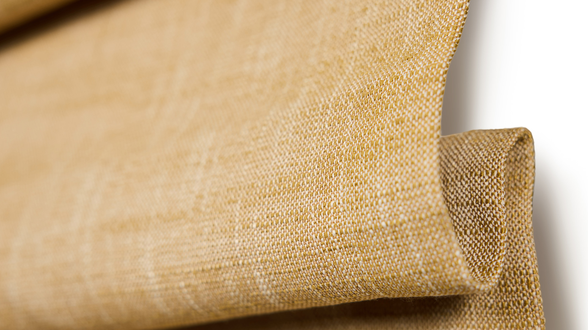 Close-up of a fabric swatch book on a vintage table.