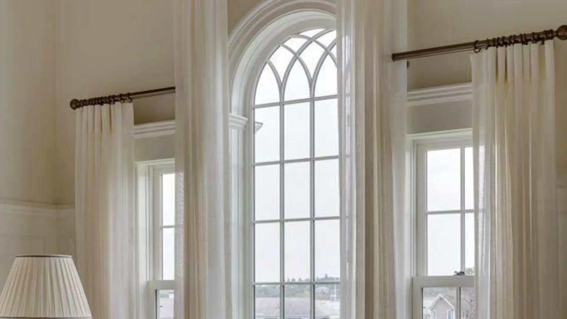 High-end MetroWest living room with dramatic drapery